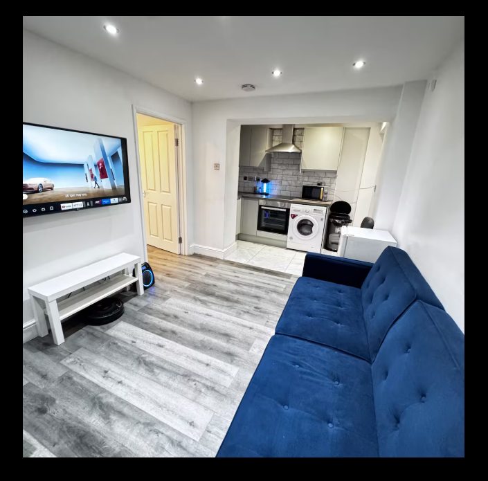 Whitehall Lane one-bedroom apartment photo 1: living room and kitchen area.