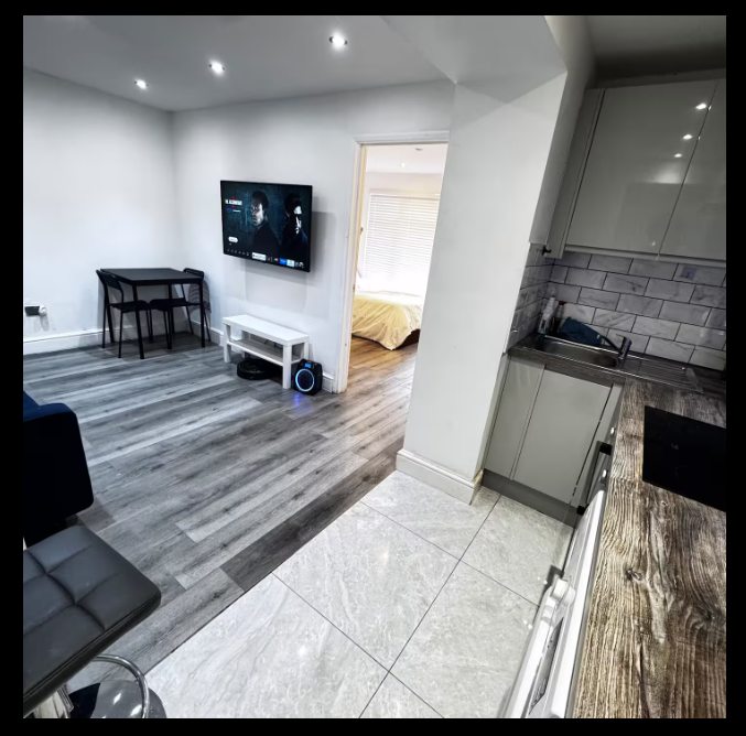 Whitehall Lane one-bedroom apartment photo 2: living room and kitchen area.