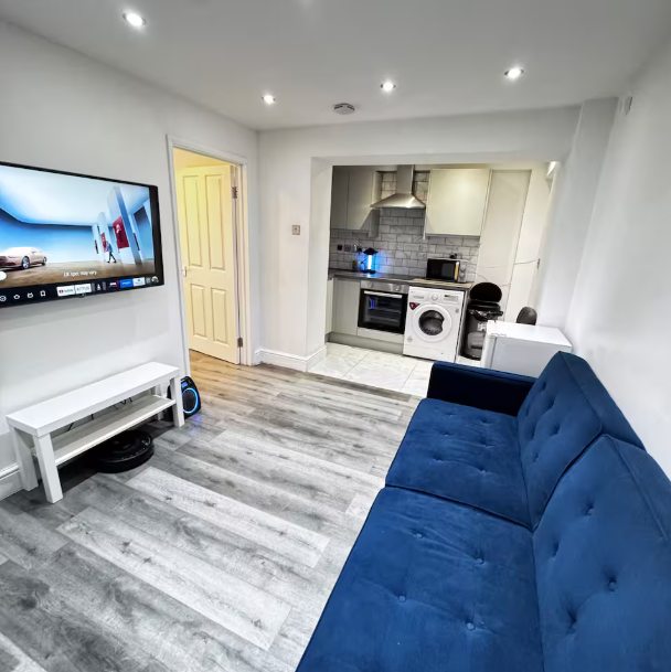 Whitehall Lane one-bedroom apartment photo 5: living room and kitchen area.
