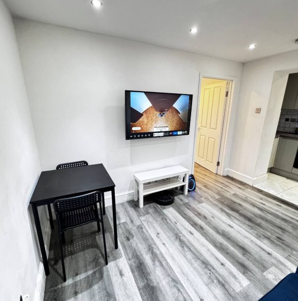 Whitehall Lane one-bedroom apartment photo 8: living room and kitchen area.